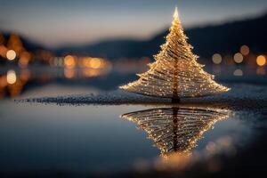 Beautiful lighted Christmas tree reflecting on calm water at dusk near a scenic landscape photo