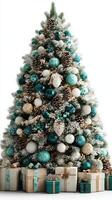 Holiday celebration with snow-covered Christmas tree adorned in teal and gold decorations with beautifully wrapped gifts underneath photo