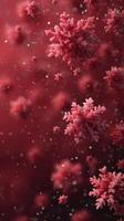 Beautiful red snowflakes delicately floating against a blurred dark background with shimmering specks of light photo