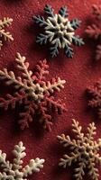 Colorful snowflakes arranged on a festive red background create a vibrant holiday atmosphere perfect for winter decorations photo