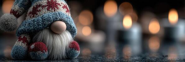 Cozy gnome decoration among warm candles creating a festive atmosphere in a dimly lit room photo