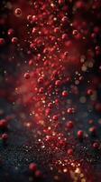Red spheres floating against a dark background create a mesmerizing cascade of colors and reflections photo