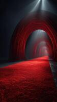 Illuminated red carpet leading through two archways in a dark setting during a gala event photo