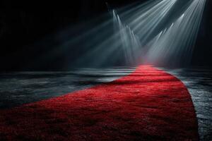 Red carpet leading to a spotlighted entrance in a dark venue creating an elegant and dramatic atmosphere photo