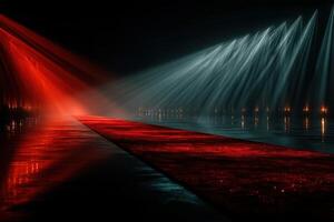 Dramatic water light show featuring vibrant red and blue hues at night near the water's edge photo
