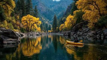 Kayaker exploring a serene river surrounded by vibrant autumn foliage in a peaceful valley photo