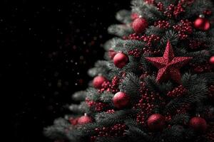 Elegant red and black Christmas tree adorned with ornaments and a star during festive season celebration photo