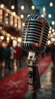 Vintage microphone stands ready for live performance at an evening outdoor event filled with twinkling lights photo
