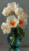 Vibrant white tulips arranged in a decorative vase displaying elegant blooms and lively colors photo