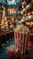 Popcorn on a seat in a grand theater adorned with soft Christmas lights during the holiday season photo