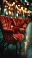 Cozy vintage chairs arranged in a warmly lit indoor space during the evening hours photo