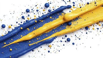 A blue and yellow paint splattered on a white surface photo