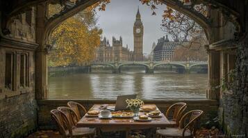 A table with chairs and a view of the river thames photo