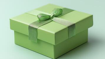 Green gift box with ribbon and bow on a light background photo
