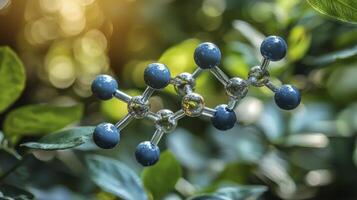 A molecule is suspended in the air with leaves in the background photo
