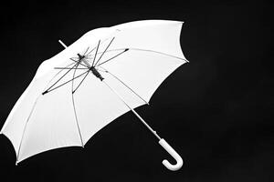 White umbrella against black photo