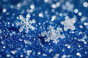 Sparkling winter snowflakes on a blue background photo