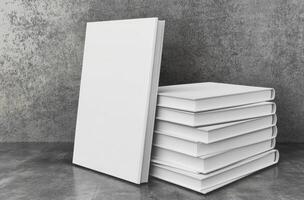 Stack of blank books on a concrete surface photo