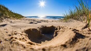 Sandy beach with a small hole, sunny day photo