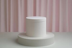 White cylinder box on light gray podium photo