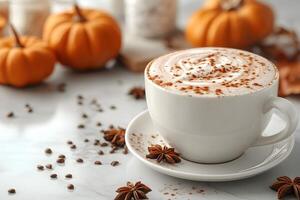 Autumn Pumpkin Spice Latte with Cinnamon and Star Anise on Marble Table photo