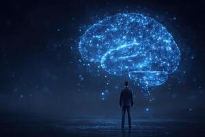 A person stands in front of a glowing digital brain outline, depicting the connection between human intelligence and technology. photo