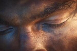 The focus is on a serene face with closed eyes, showcasing the texture of the skin and the play of light and shadow. Subtle tones create a calming atmosphere. photo