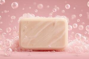 A smooth bar of soap sits prominently on a pink surface, surrounded by white bubbles. The soft hues create a gentle and calming atmosphere, ideal for a hygiene or self-care theme. photo
