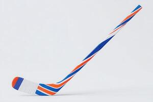 A brightly colored hockey stick features a dynamic design with blue, orange, and white stripes. It stands upright on a plain background, emphasizing its unique style and craftsmanship. photo