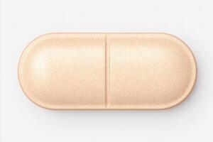 A light tan capsule sits on a white surface. The capsule is oval-shaped with a smooth outer layer, featuring a dividing line in the center. It appears to be a dietary supplement or medication. photo