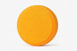 A round orange tablet is displayed on a clean white surface. Its smooth texture and bright color make it stand out. The focus on the tablet highlights its size and design. photo