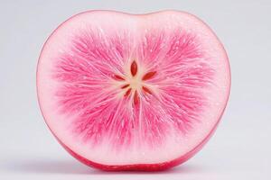 The vividly pink cross-section of a watermelon radish reveals detailed, natural patterns and a glossy surface. This striking vegetable is sliced to showcase its unique features and color contrast. photo