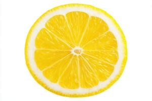 A lemon slice reveals its vibrant yellow color and characteristic segments. The clean cut shows the juicy pulp and essential oils of the fruit, lying against a plain white background. photo