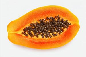 This ripe papaya is sliced in half, revealing its bright orange interior dotted with small, glossy black seeds. The fruit is fresh and ready for culinary use or consumption. photo