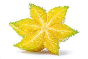 A vibrant star fruit, also known as carambola, sits centered against a white backdrop. The fruits yellow skin glistens with water droplets, showcasing its fresh appearance and unique shape. photo