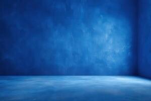 A striking bright blue interior space features textured walls and a smooth floor. Soft light enhances the color, creating a tranquil atmosphere, perfect for artistic expression or relaxation. photo