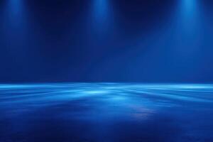 Dark blue background featuring smooth, reflective surface illuminated by bright spotlights. The lighting creates a dramatic and mysterious ambiance, suitable for performances or events at night. photo