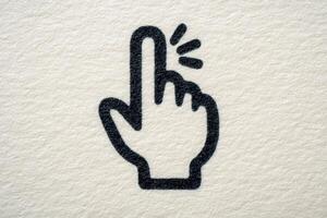 A graphic representation of a hand with an extended finger pointing upwards. The design is bold and simple, set against a textured beige background, highlighting clarity and focus. photo