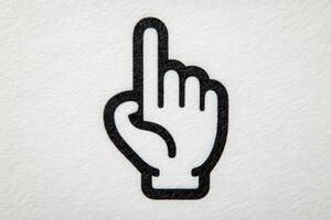 A graphic shows a hand with one finger raised, symbolizing an important point or request for attention. This design is simple and emphasizes clarity in communication. photo