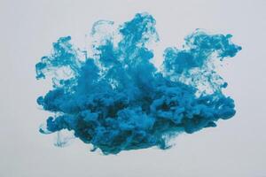 A vibrant blue cloud of smoke billows against a light background, creating an abstract and dynamic visual. The swirling patterns evoke movement and engage the viewers imagination. photo