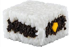 A creative rice dish features white sticky rice formed into a rectangular block, filled with black seaweed paste and a small yellow ingredient peeking through. photo