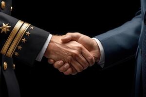 Two hands engage in a firm handshake, representing partnership and mutual respect. photo