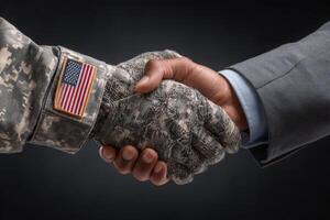 A soldier in a camouflage uniform shakes hands with a man in a business suit, representing partnership and mutual respect. The contrasting attire highlights different backgrounds yet shared goals. photo