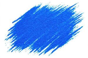 A vibrant blue paint swatch displays rich texture on a white background. The strokes appear forceful and artistic, ideal for creative design projects or color selection. photo