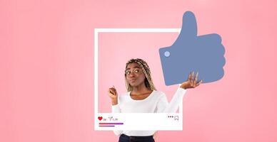 A social media influencer interacts with a thumbs up graphic, promoting positive engagement in a playful setting. The pink background adds a vibrant touch to the content creation experience. photo