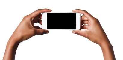 Black hands holding mobile smartphone with blank screen, isolated on white background. Copy space for advertisement of mobile app, mockup photo