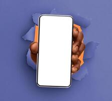 Mobile App, Great Offer. Closeup of black male hand holding smartphone with white empty screen showing device close to camera breaking through paper sheet. Gadget display with free copy space, mock up photo