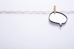 Creative ideas concept. Blank speech bubble hadcrafted on white background, top view, copy space for text photo