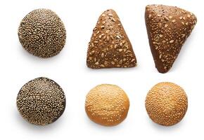 Buns and rolls assortment at white background. Triangle rye buns with sunflower seeds, black and white humburger buns with sesame. Flat lay, top view, isolated photo