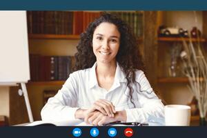 Virtual Communication. Head shot portrait of smiling young female employee worker sitting at desk, having call with colleagues at online meeting, using computer software app, laptop screen view photo